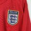 Koszulka piłkarska Anglia, 2006/08 Home, stan zadowalający - brak gwiazdki nad herbem, popękane logo umbro oraz zaciągnięcie pod kołnierzem na froncie.- widok