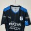 Koszulka piłkarska Queretaro FC, 2015/16 Home, stan zadowalający - uszkodzony herb klubowy oraz znaczna ilość mikro zaciągnięć.- zbliżenie na front