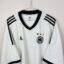 Koszulka piłkarska Niemcy, 2002/04 Home, stan dobry - dwa drobne zaciągnięcia i zabrudzenia.- zbliżenie na front