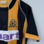 Cambridge United FC Fußballtrikot, 2007/08 Home, befriedigender Zustand - genähter Stoff auf der Vorderseite und erhebliches Ziehen am Ärmel.weitere Ansicht 3