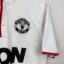 Manchester United Fußballtrikot, 2012/13 Away, schlechter Zustand - erhebliche Menge an Micro-Pulls und ein paar kleinere Flecken - Nahaufnahme auf der Vorderseite