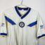 Leeds United FC football shirt, 1986/88 Home, poor condition - two red spots and significantly torn material on side of shirt under armpit.- close-up of front