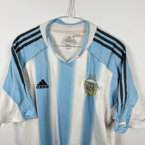 IMG_1291 Argentina football shirt, 2004/06 Home, poor condition - two holes on left sleeve and minor soiling on front and one on back.- close-up of front