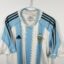 Argentina football shirt, 2004/06 Home, poor condition - two holes on left sleeve and minor soiling on front and one on back.- close-up of front