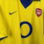 Arsenal FC football shirt, 2003/04 Away, satisfactory condition - damaged sponsor logo on front, minor soiling next to manufacturer's stamp and some micro