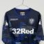 Leeds United FC football shirt, 2018/19 Away, poor condition - heavily damaged print on both front and back of shirt.- close-up of front