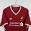 Koszulka piłkarska Liverpool FC, 2017/18 Home, stan słaby - wyraźne plamy na froncie koszulki, mikro pęknięcia na nadruku sponsora oraz na paskach na plecach.-