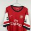 Koszulka piłkarska Arsenal FC, 2012/14 Home, stan bardzo dobry - mikro zaciągnięcie przy herbie oraz nieznacznie urwany szew.- zbliżenie na front